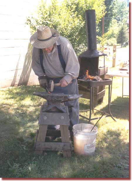 Blacksmith at work near our herb garden ... one of our 2002 events