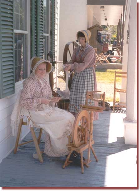 Spinning yarn on the porch of the Pratt Museum ... one of our 2002 events