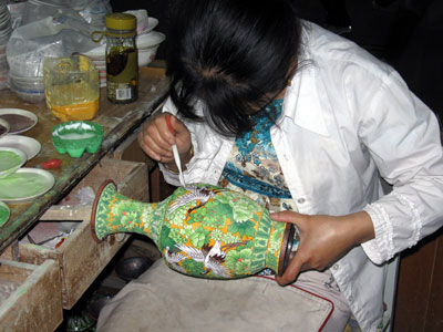 Working on a cloisonn� vase ... click to see a large image
