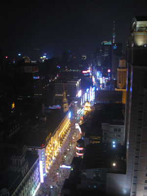Nanjing Lu, Shanghai's main shopping street, from our window ... click to see a large image.