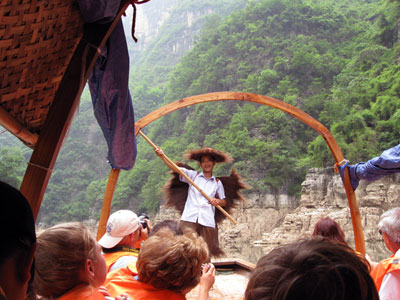 A funny old man joined our "sampan" to sing a few old songs and pose for photos ... click to see a large image
