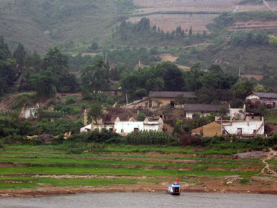 Houses are being taken down before the water rises even further ... click to see a large image