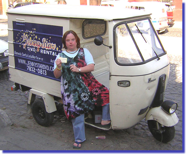 Jenny and her tuk-tuk that delivers movies in Antigua